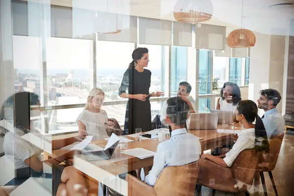 People in a bright boardroom